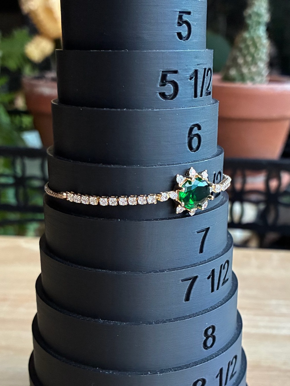 Gold Tennis Bracelet with Emerald Green Centerstone